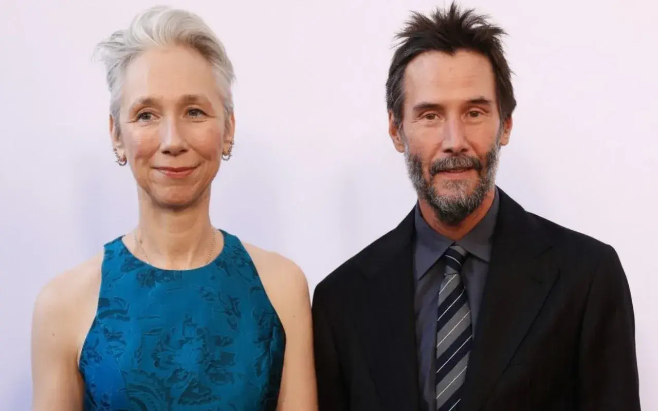 Keanu Reeves z żoną Alexandrą Grant na czerwonym dywanie.